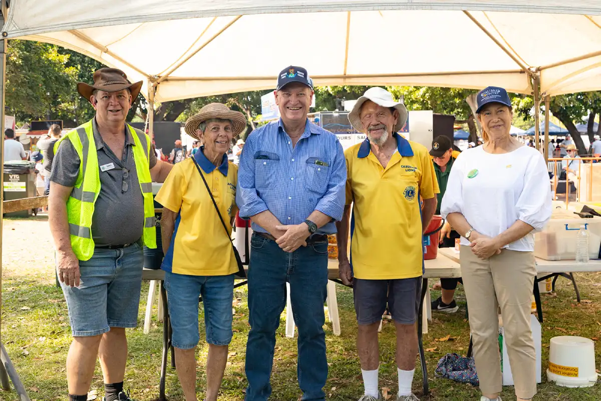 His Honour poses for a group photo at the Official Opening of the 2026 Beer Can Regatta